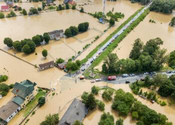 Aerial view of flooded houses and rescue vehicles saving people in Halych town, western Ukraine.