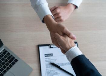 Businessmen and job seekers shake hands after agreeing to accept a job and approve it as an employee in the company. Or a joint venture agreement between the two businessmen