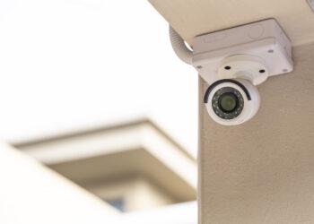 CCTV on the pillar of a house on white background