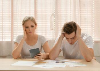 Couples with financial problems Being in a stressful mood and finding a solution for family financial problems, Need to talk about financial plans with financial advisors.