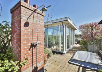 Cozy interior covered veranda with panoramic windows
