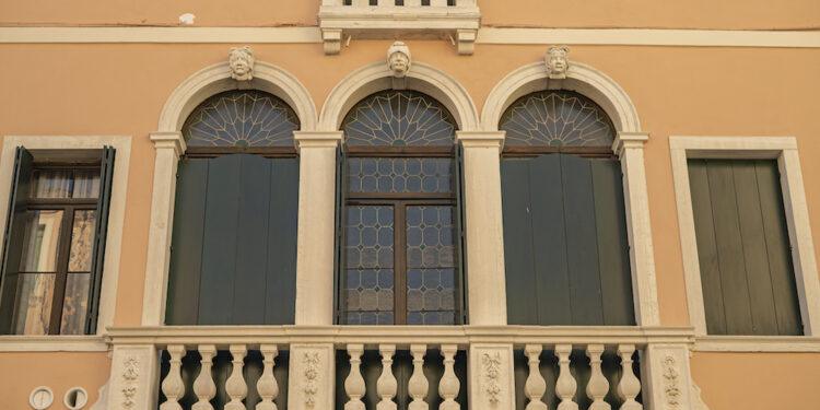 Detail of Balcony with arch in historic building