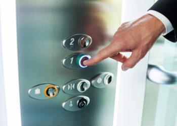 Man pushing button. Close-up of male hand pushing button of elevator