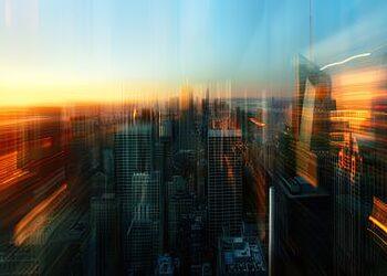 Softly blurred skyline of city at sunset