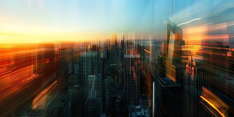 Softly blurred skyline of city at sunset